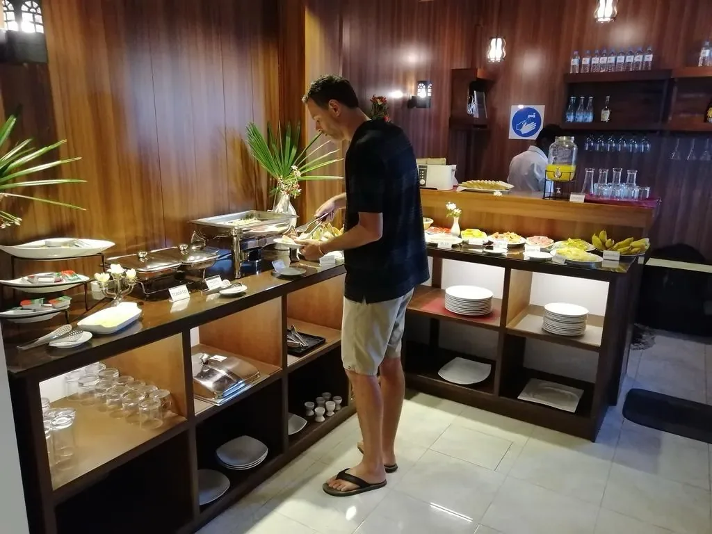 Guests selecting from the rich morning breakfast buffet