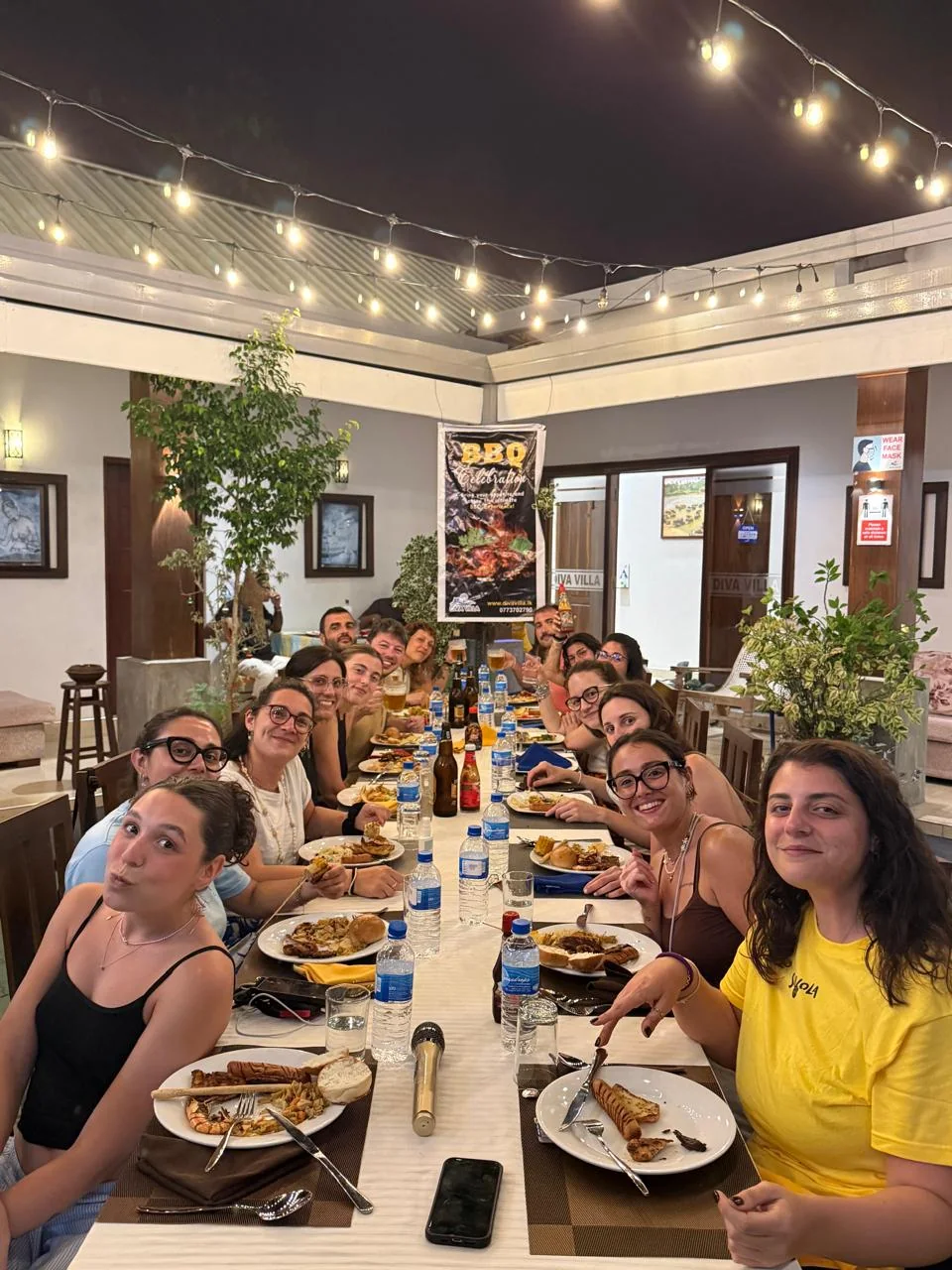Group of guests dining together at Diva Villa