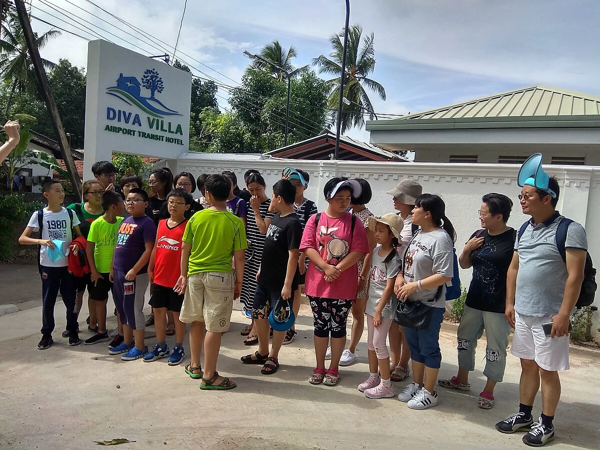 Tour group arrival at Diva Villa entrance